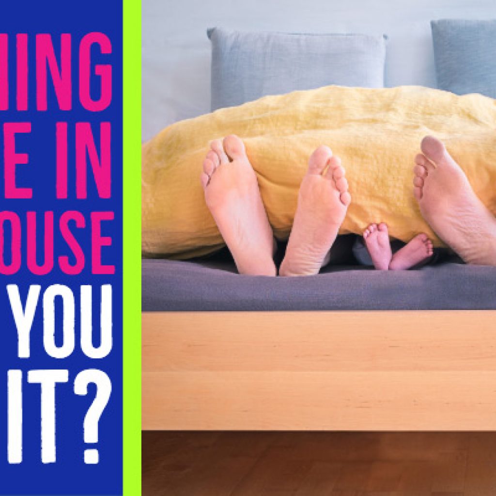 three sets of feet at edge of bed