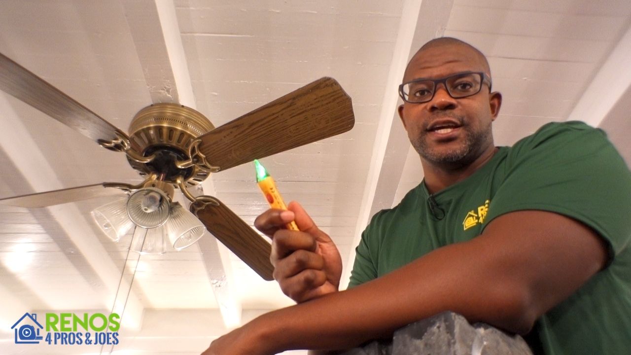 man holding electrical voltage tester